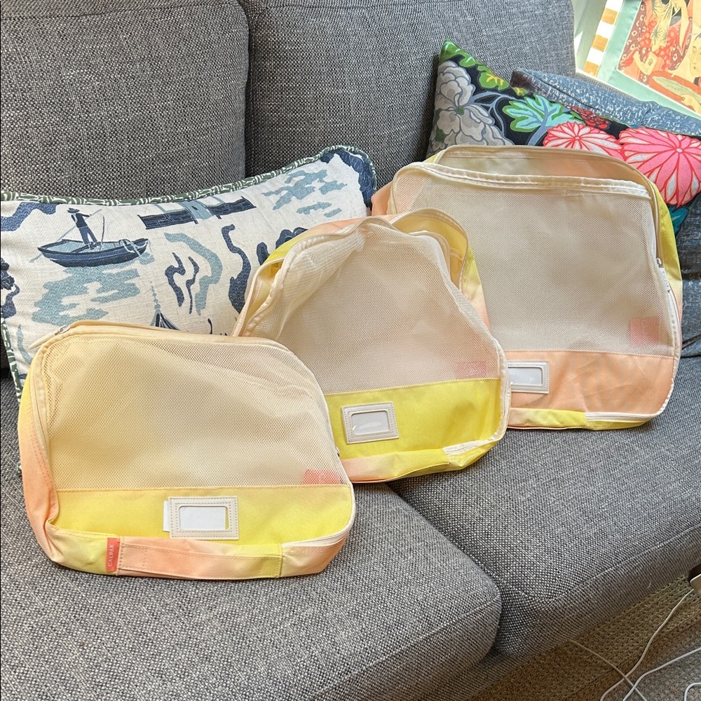 Calpak Yellow and Cream Garment Bags